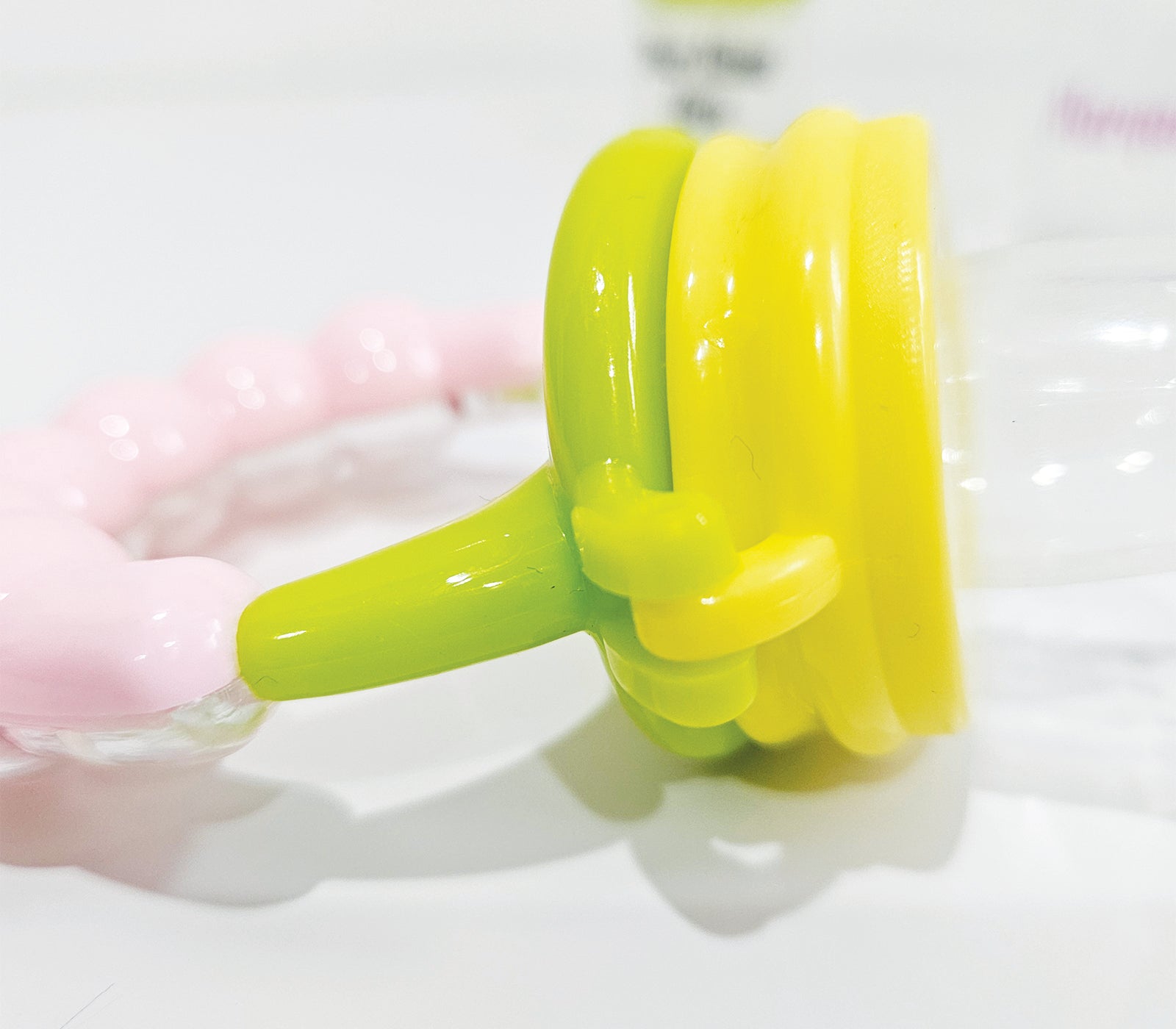 Personalised baby fruit dummy with built-in rattle, customizable with a name. Perfect for soothing and teething, this dummy combines fun and practicality. Ideal for introducing fruits safely while keeping babies entertained with the rattle sound