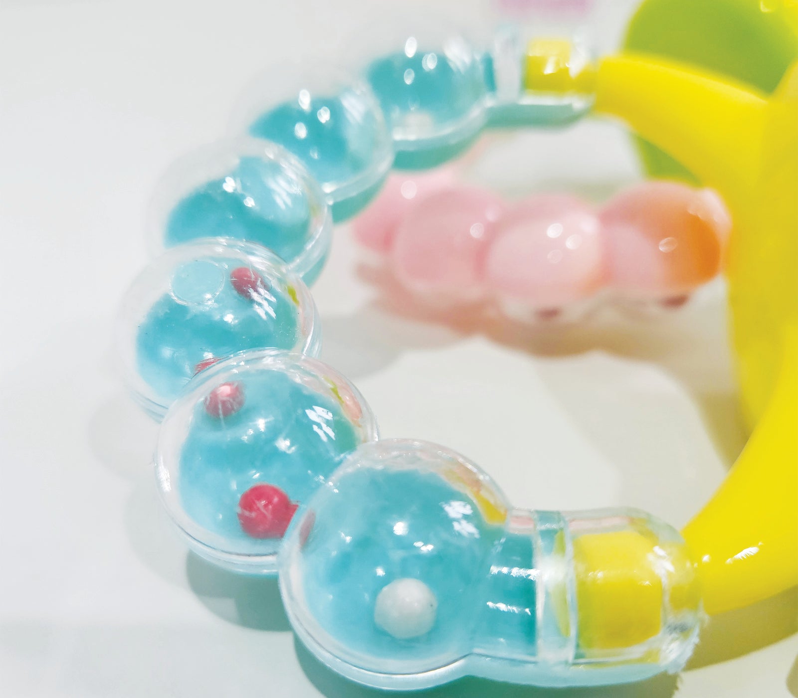 Personalised baby fruit dummy with built-in rattle, customizable with a name. Perfect for soothing and teething, this dummy combines fun and practicality. Ideal for introducing fruits safely while keeping babies entertained with the rattle sound