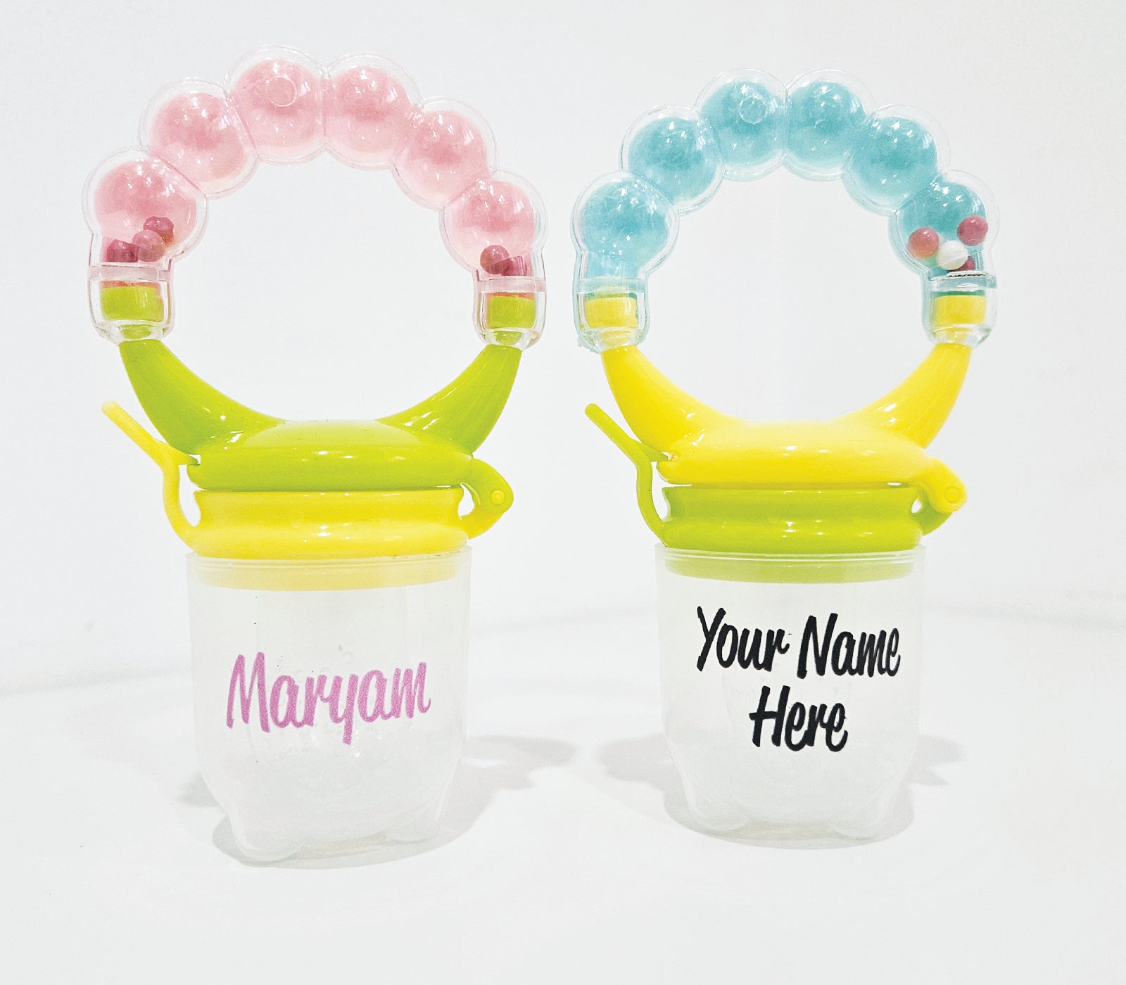 Personalised baby fruit dummy with built-in rattle, customizable with a name. Perfect for soothing and teething, this dummy combines fun and practicality. Ideal for introducing fruits safely while keeping babies entertained with the rattle sound