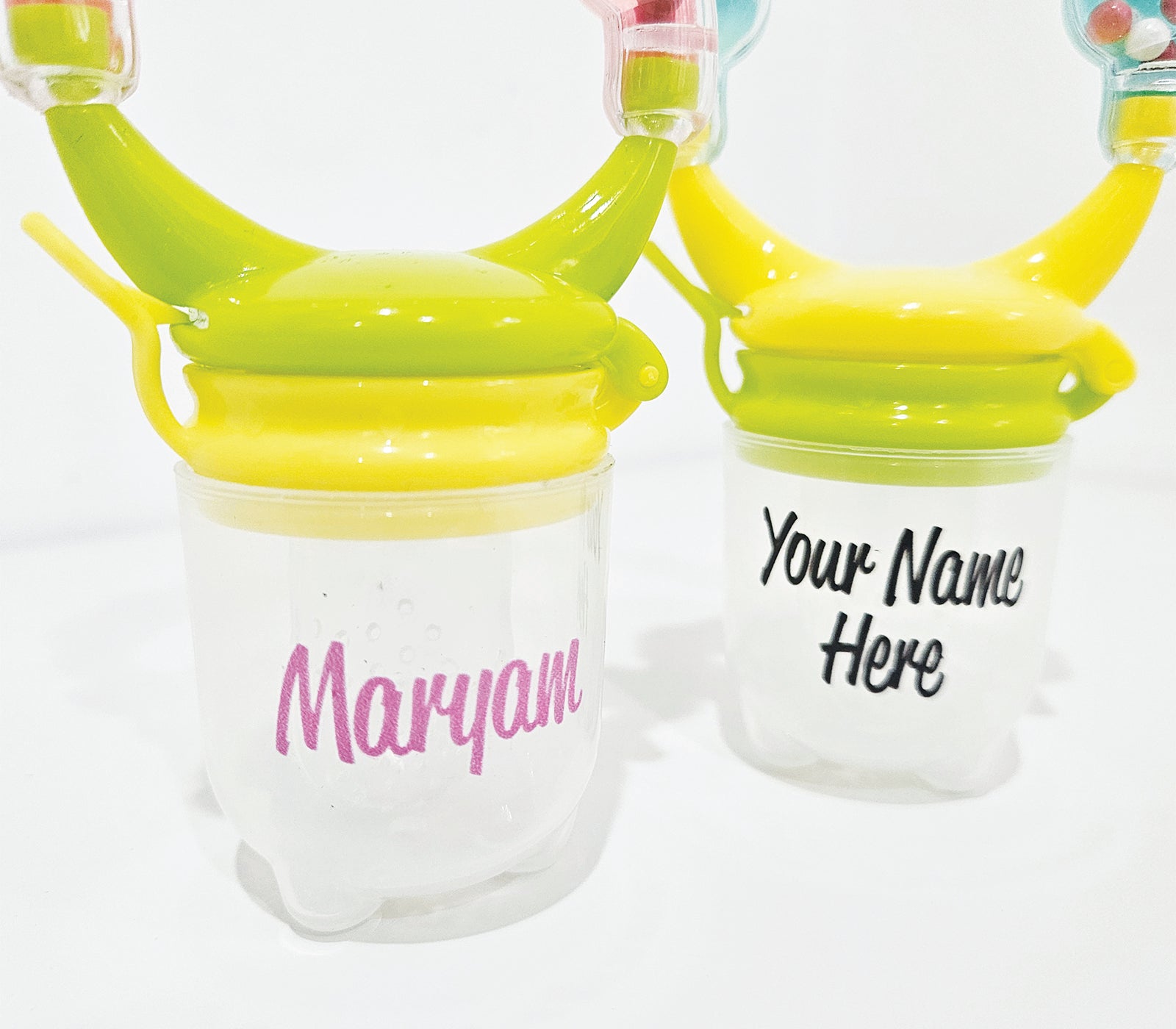 Personalised baby fruit dummy with built-in rattle, customizable with a name. Perfect for soothing and teething, this dummy combines fun and practicality. Ideal for introducing fruits safely while keeping babies entertained with the rattle sound