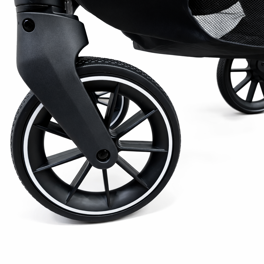 Close-up of a black stroller front wheel 
