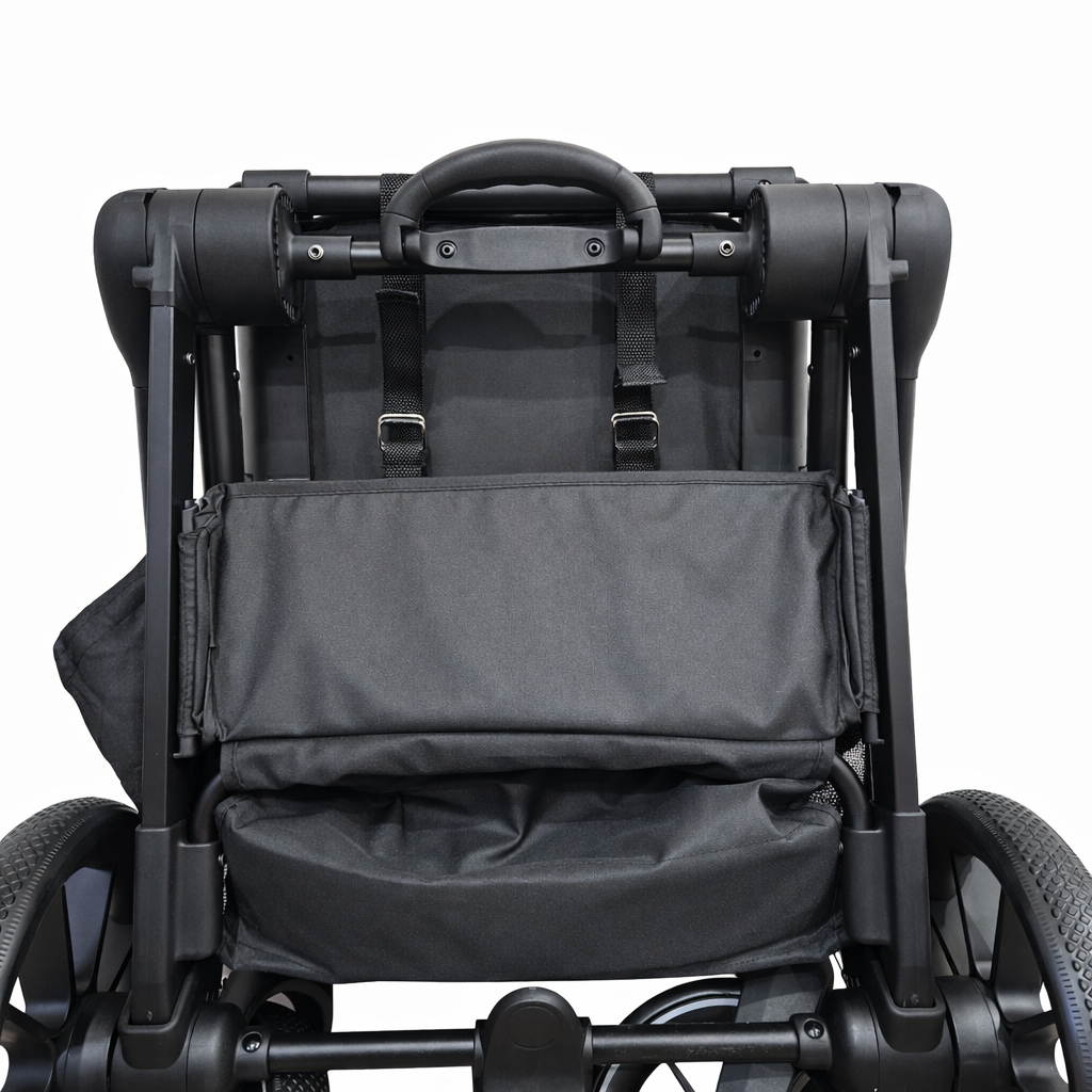 Close-up of a black stroller with a focus on the backrest and seat area.