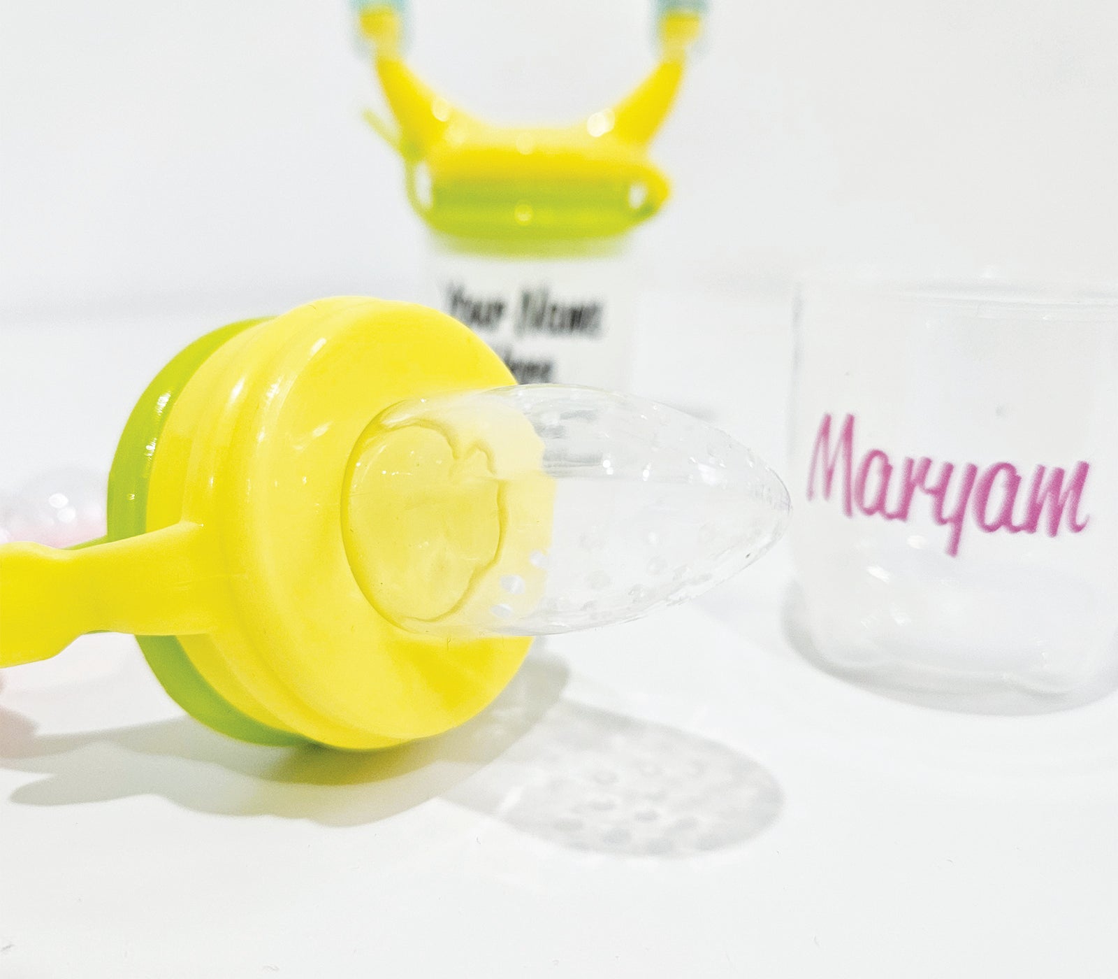 Personalised baby fruit dummy with built-in rattle, customizable with a name. Perfect for soothing and teething, this dummy combines fun and practicality. Ideal for introducing fruits safely while keeping babies entertained with the rattle sound