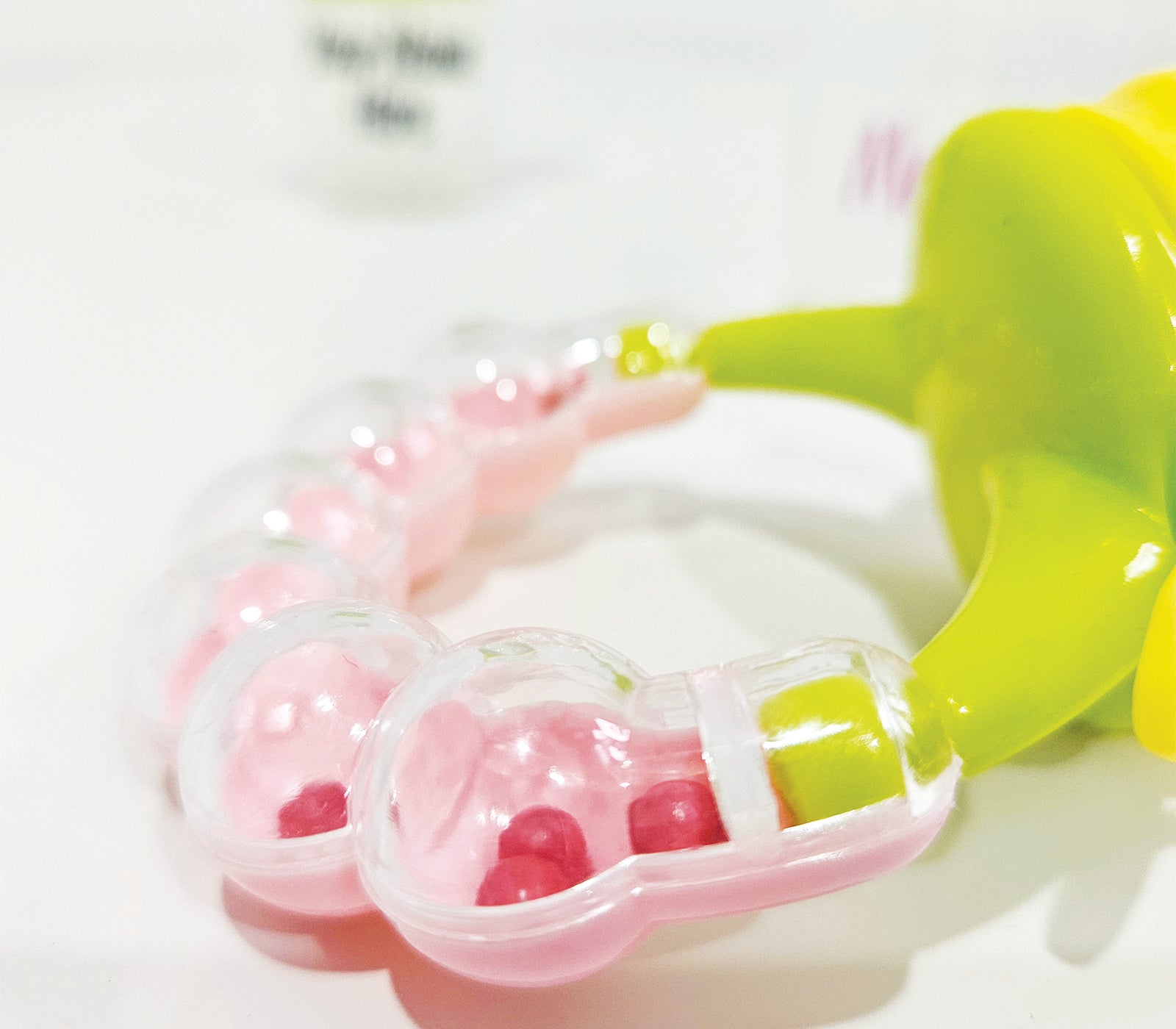 Personalised baby fruit dummy with built-in rattle, customizable with a name. Perfect for soothing and teething, this dummy combines fun and practicality. Ideal for introducing fruits safely while keeping babies entertained with the rattle sound