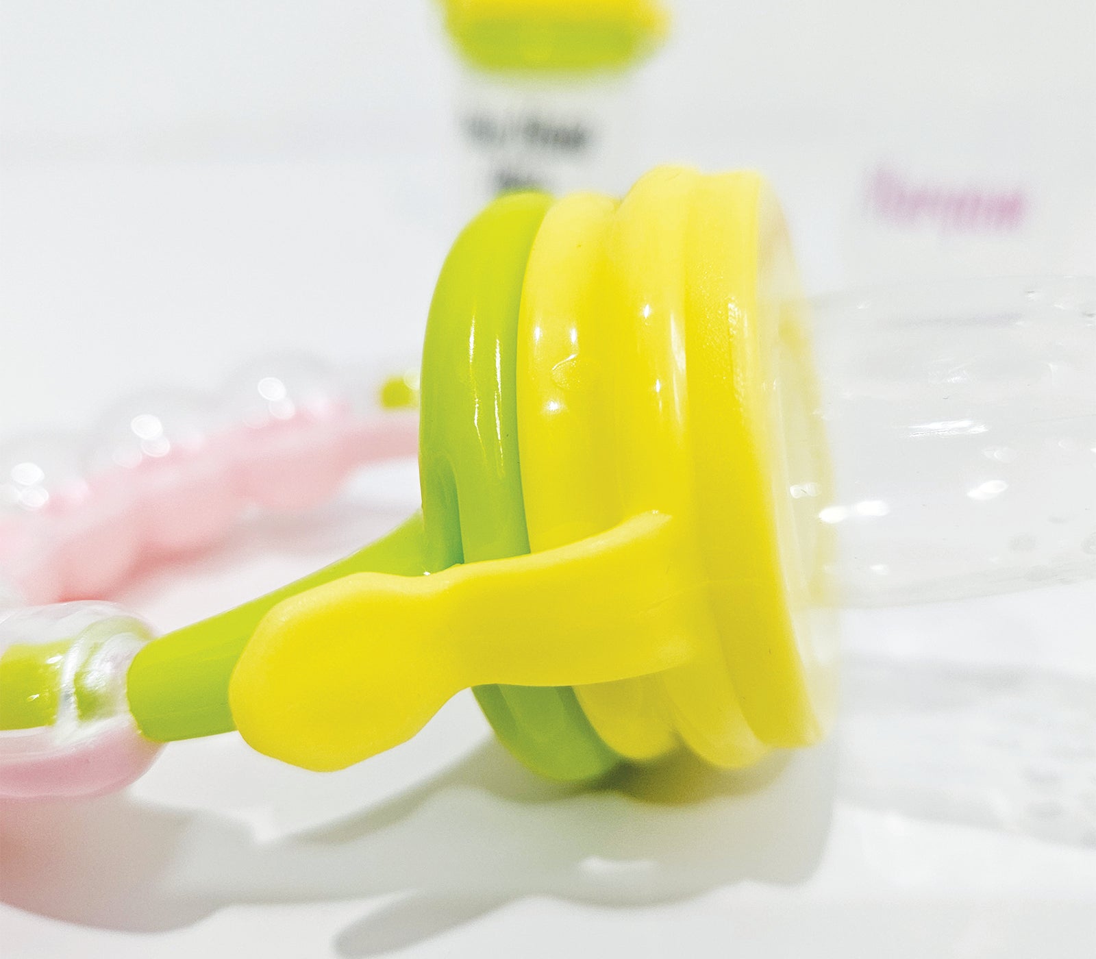 Personalised baby fruit dummy with built-in rattle, customizable with a name. Perfect for soothing and teething, this dummy combines fun and practicality. Ideal for introducing fruits safely while keeping babies entertained with the rattle sound