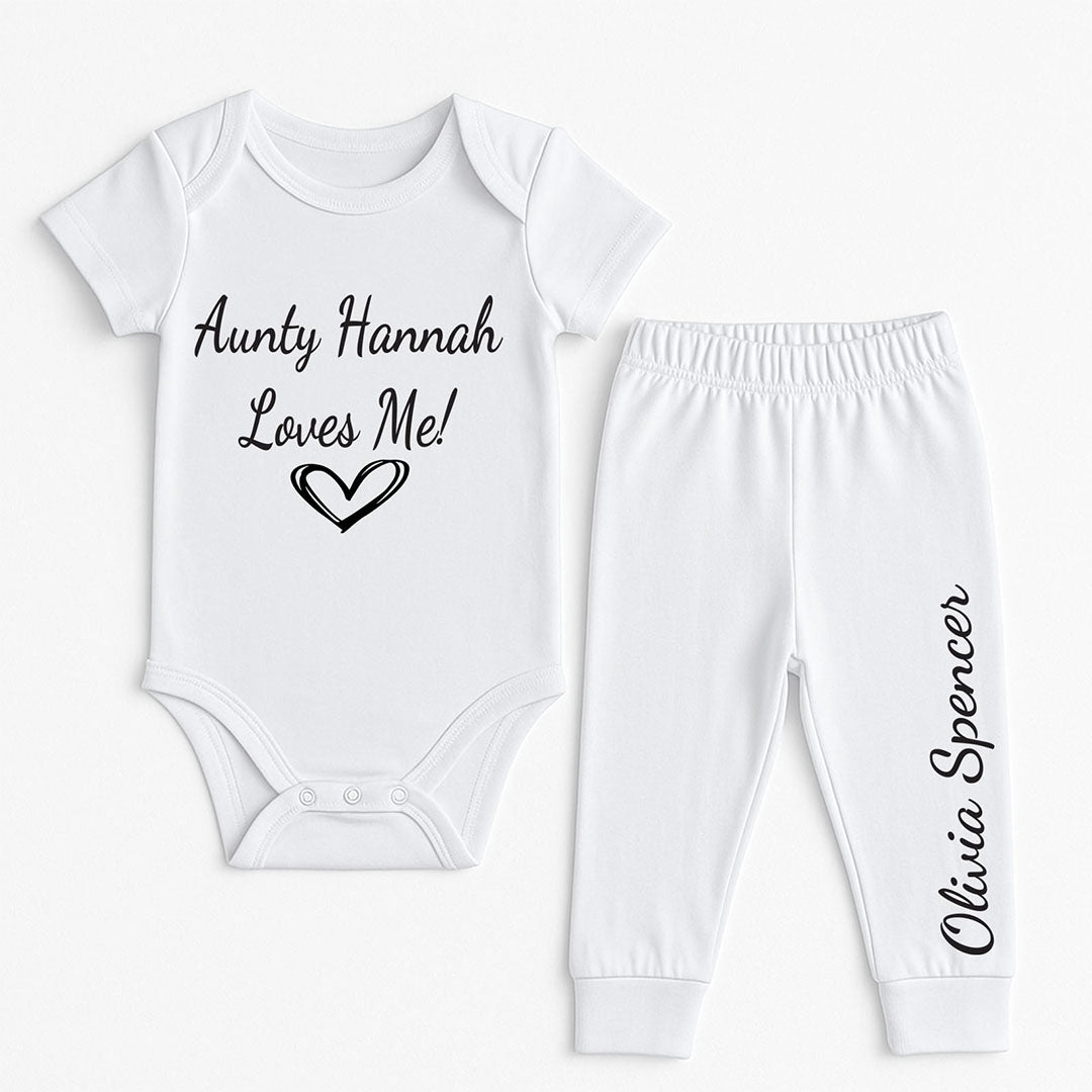 Cute white baby outfit with short-sleeve bodysuit printed "Aunty Hannah Loves Me!" and matching pants with the name "Olivia Spencer". Custom baby shower or niece/nephew gift idea.