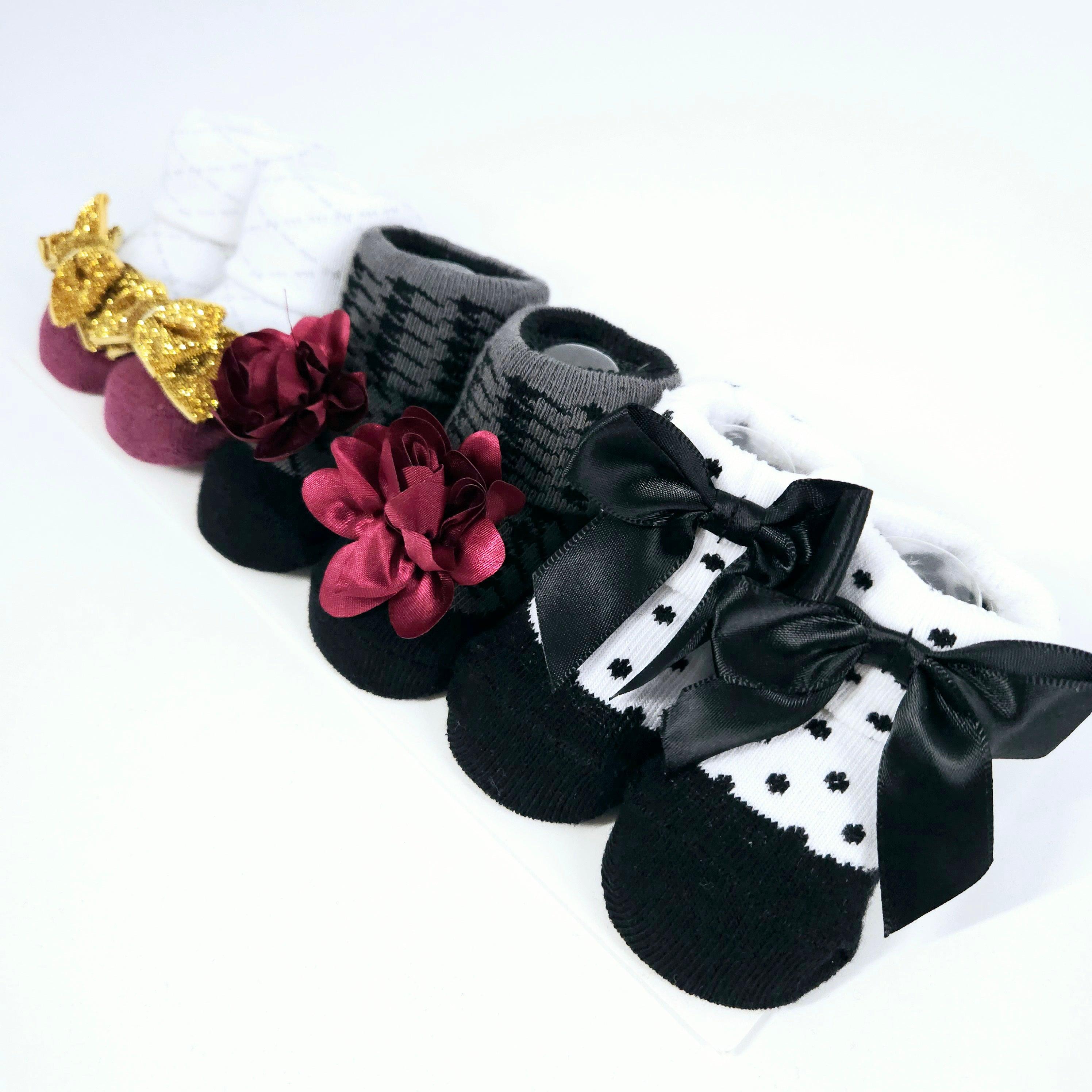 Baby girls' 3-pack flower and bow socks – soft, breathable, and stylish infant socks with adorable floral and bow designs, perfect for newborns and toddlers.