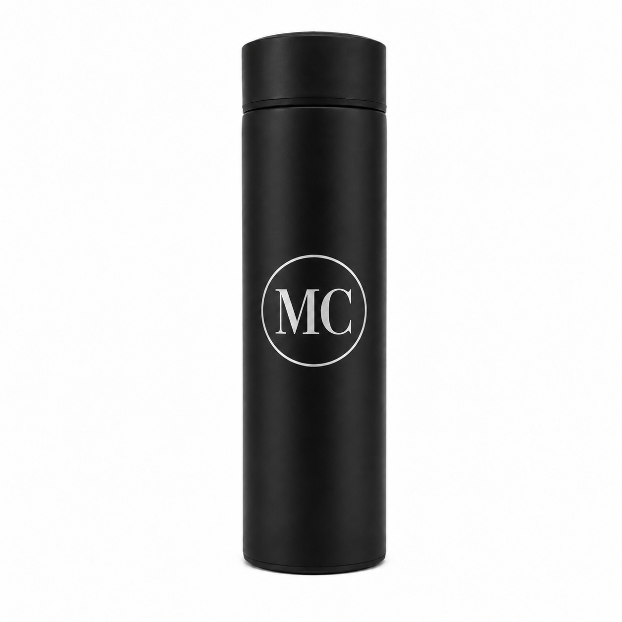 A matte black insulated travel tumbler with a matching lid, featuring a white circular monogram logo with the letters 'MC' in the center, shown on a plain white background.