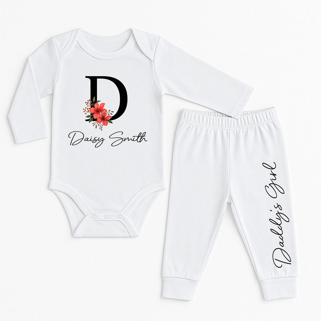 Custom white baby bodysuit and pants with “Daisy Smith” and “Daddy’s Girl” text, featuring floral embellishments – perfect for daddy-daughter bonding.