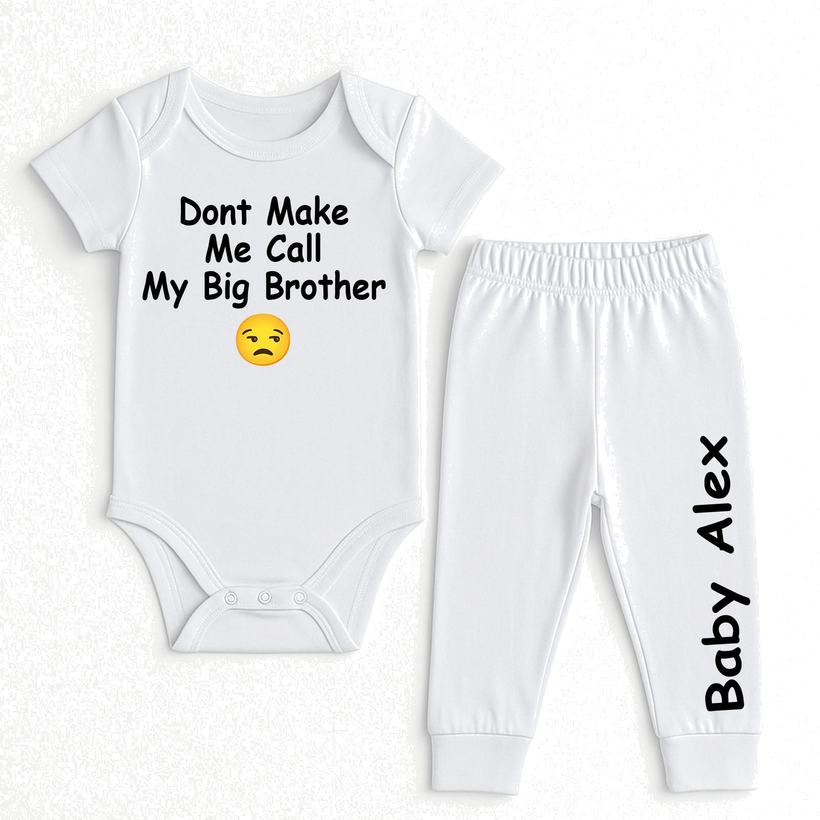 A two-piece baby clothing set consisting of a white short-sleeve bodysuit and matching jogger pants. The bodysuit features the black printed text 'Dont Make Me Call My Big Brother' with a yellow sad face emoji.