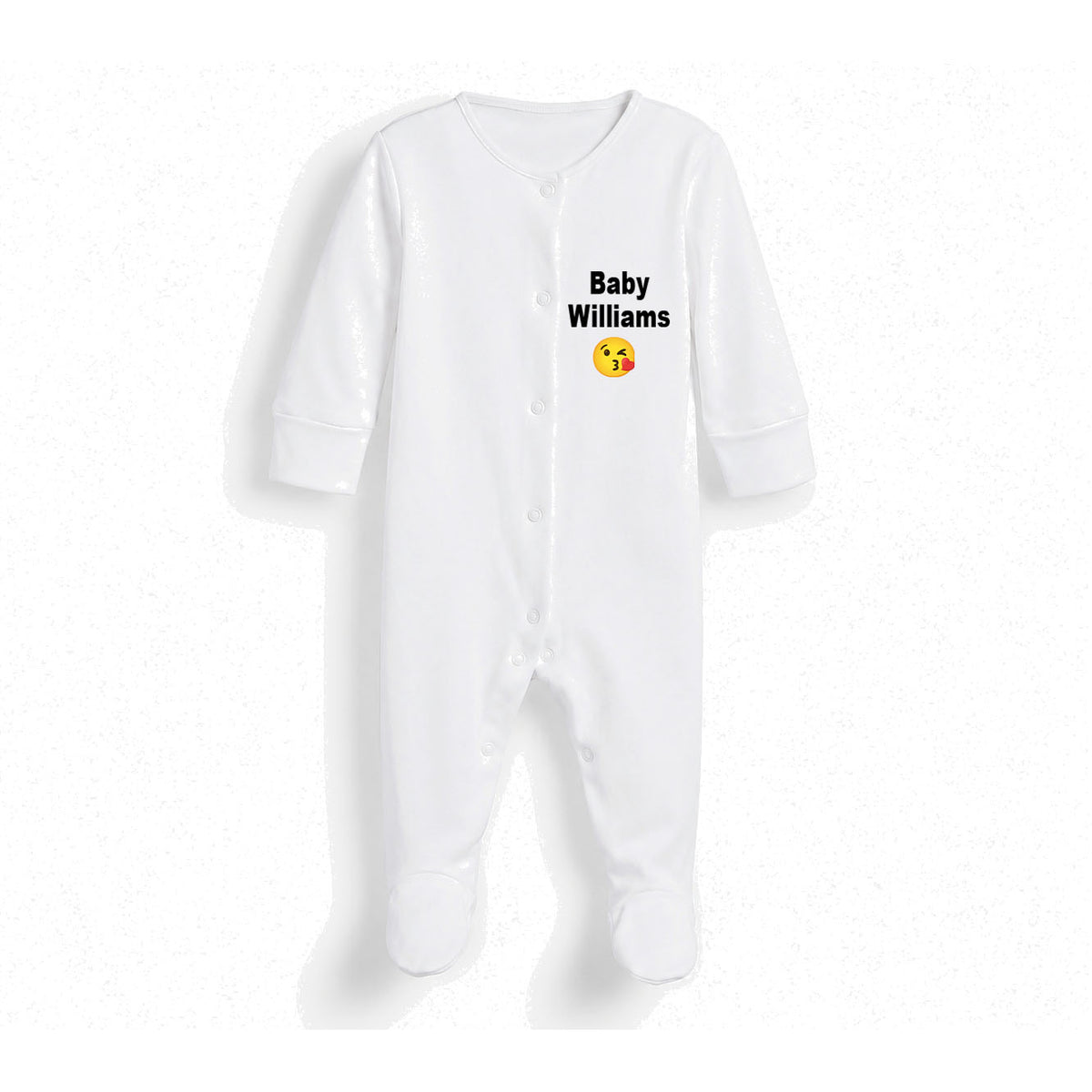 A white long-sleeve baby footed sleeper with snap closures and the text 'Baby Williams' printed on the chest above a yellow winking emoji, shown on a white background.