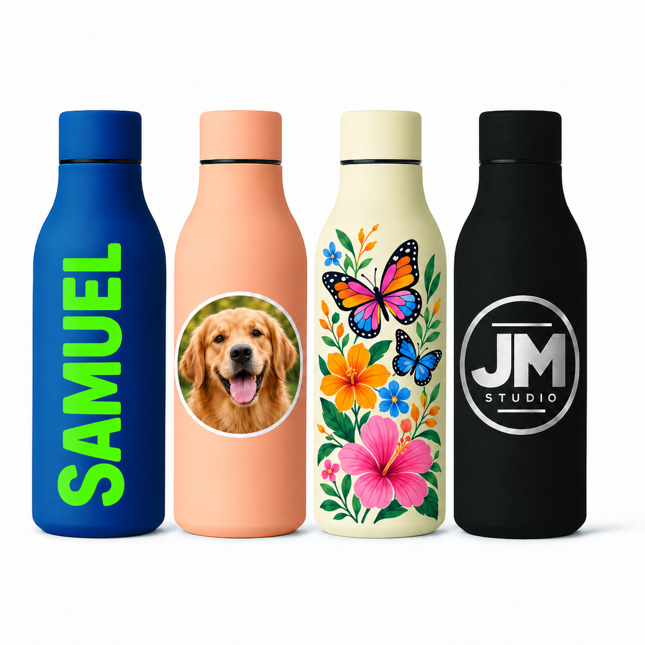 Four insulated water bottles standing side by side on a white background: a blue bottle with green vertical text reading SAMUEL, a peach bottle with a circular dog photo print, a cream floral bottle with colorful butterflies and flowers, and a black bottle with a circular JM STUDIO logo.