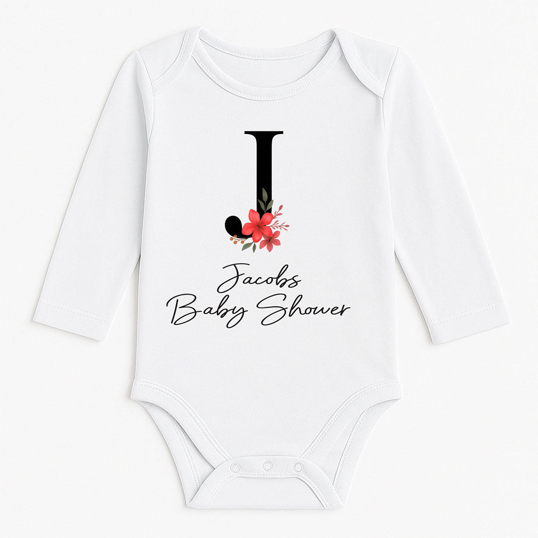 Long-sleeved white onesie with floral letter “J” and the phrase “Jacob’s Baby Shower” – stylish and meaningful for baby shower celebrations.