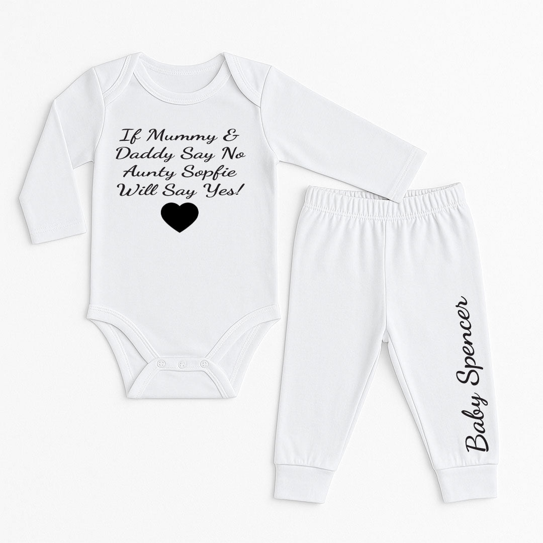 A two-piece baby outfit set consisting of a long-sleeve white bodysuit and matching jogger pants. The bodysuit features the black printed text 'If Mummy & Daddy Say No Auntie Sophie Will Say Yes!' above a small black heart.