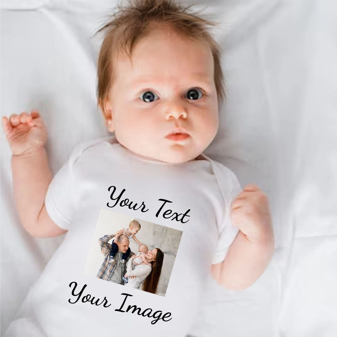 A white baby onesie featuring customizable black cursive text and a centered family photo of a couple holding a baby and toddler. The playful design is perfect for creating unique baby gifts or commemorating family memories. The onesie is designed to be soft and gentle for newborns and infants.