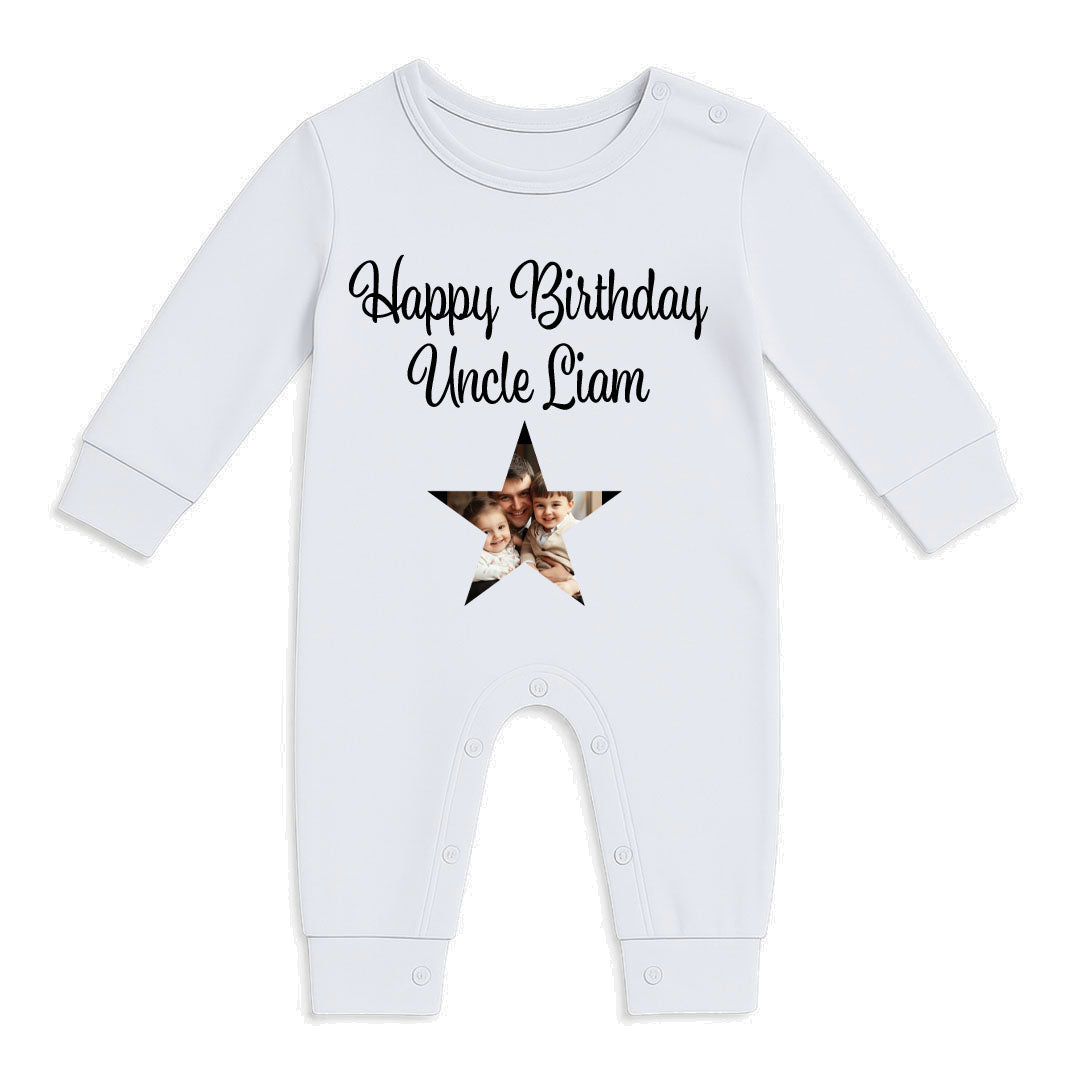 A white long-sleeve baby romper with 'Happy Birthday Uncle Liam' printed in black script above a custom photo-filled star, shown on a plain white background.