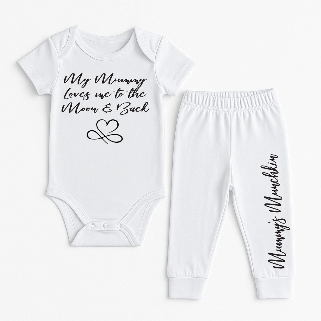 A two-piece baby clothing set consisting of a white short-sleeve bodysuit and matching jogger pants, both printed with black script text. The bodysuit reads 'My Mummy Loves me to the Moon & Back' with an infinity heart graphic, and the pants have 'Mummy's Munchkin' printed down the leg.