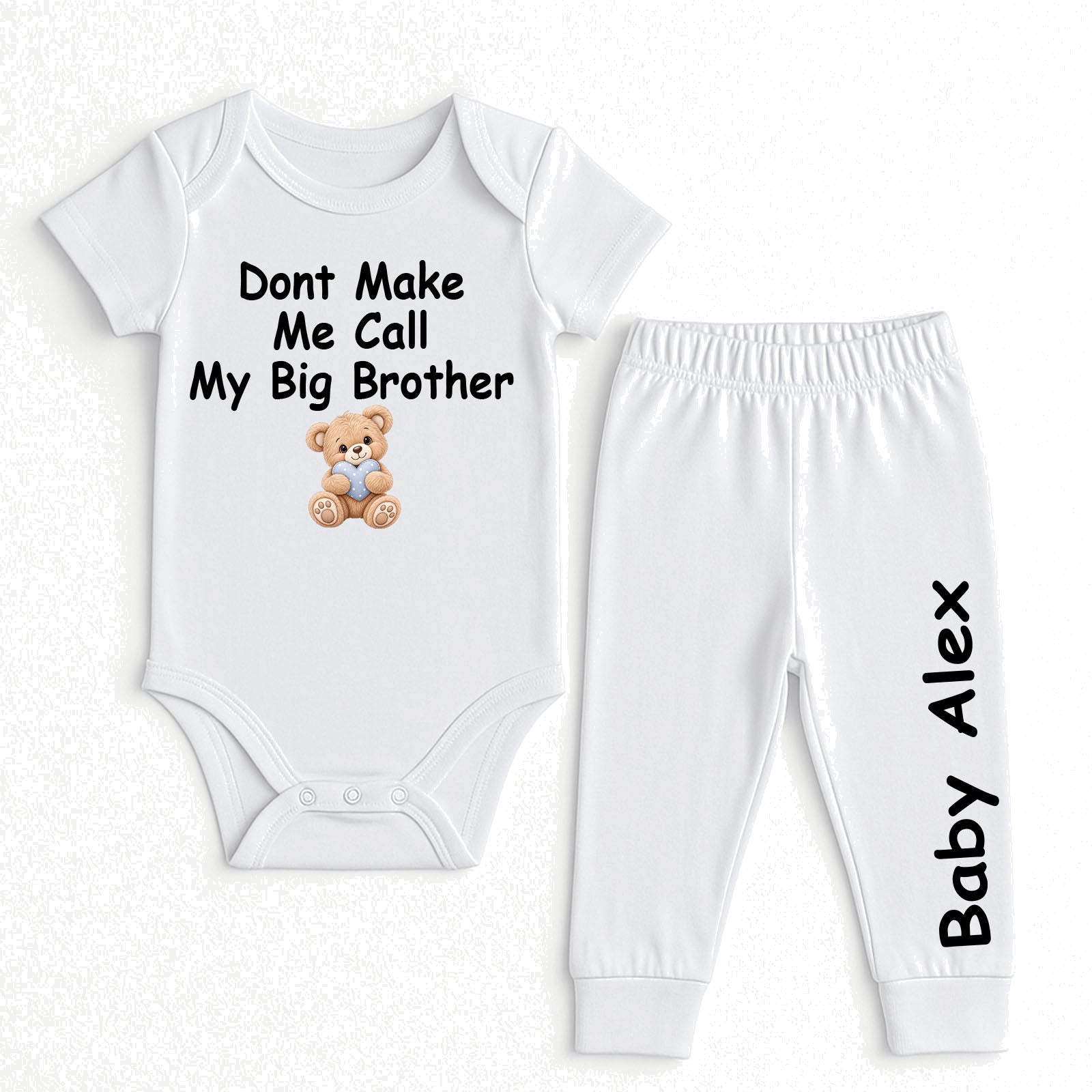 A two-piece baby clothing set consisting of a white short-sleeve bodysuit and matching white jogger pants. The bodysuit features the black printed text 'Dont Make Me Call My Big Brother' above a small brown teddy bear graphic.