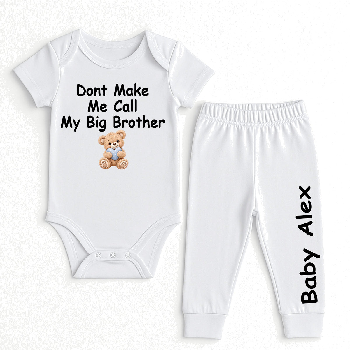 A two-piece baby clothing set consisting of a white short-sleeve bodysuit and matching white jogger pants. The bodysuit features the black printed text 'Dont Make Me Call My Big Brother' above a small brown teddy bear graphic.
