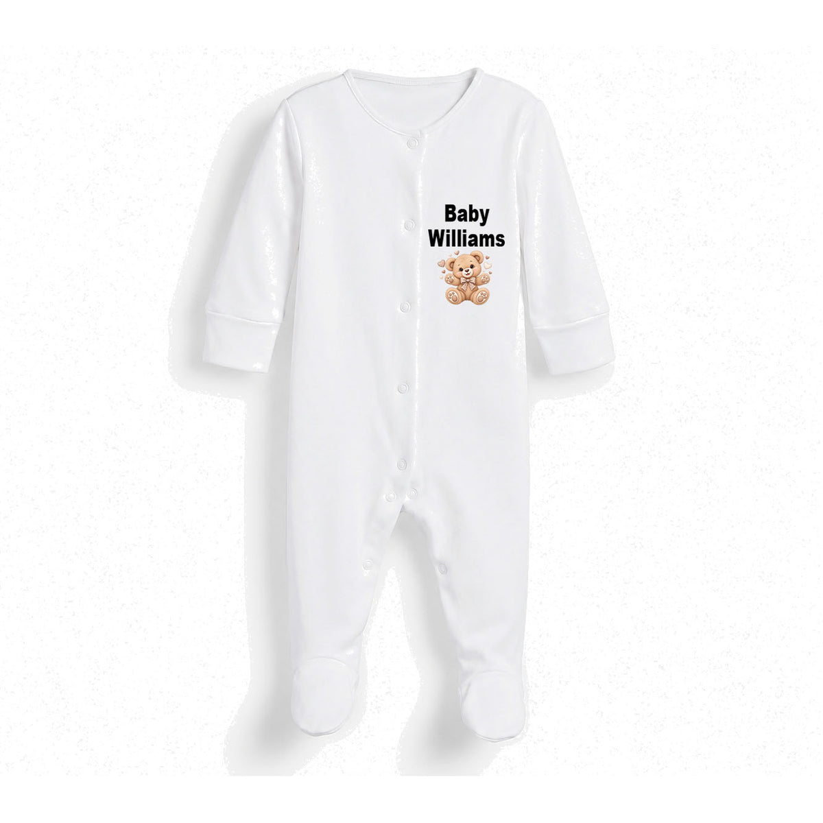 A white long-sleeve baby footed sleeper with snap closures, featuring the text 'Baby Williams' and a small teddy bear graphic printed on the chest.