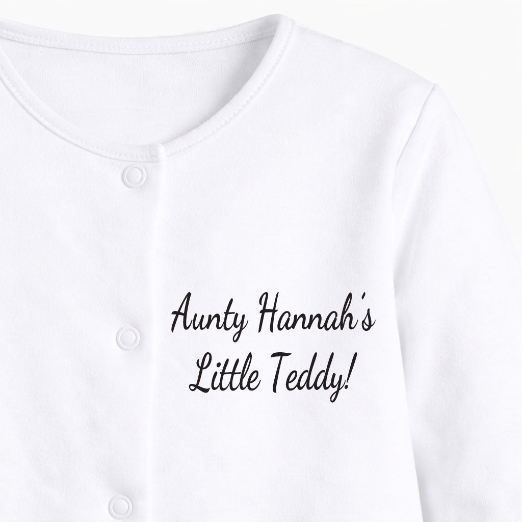 White baby onesie with 'Aunty Hannah's Little Teddy' text on a white background