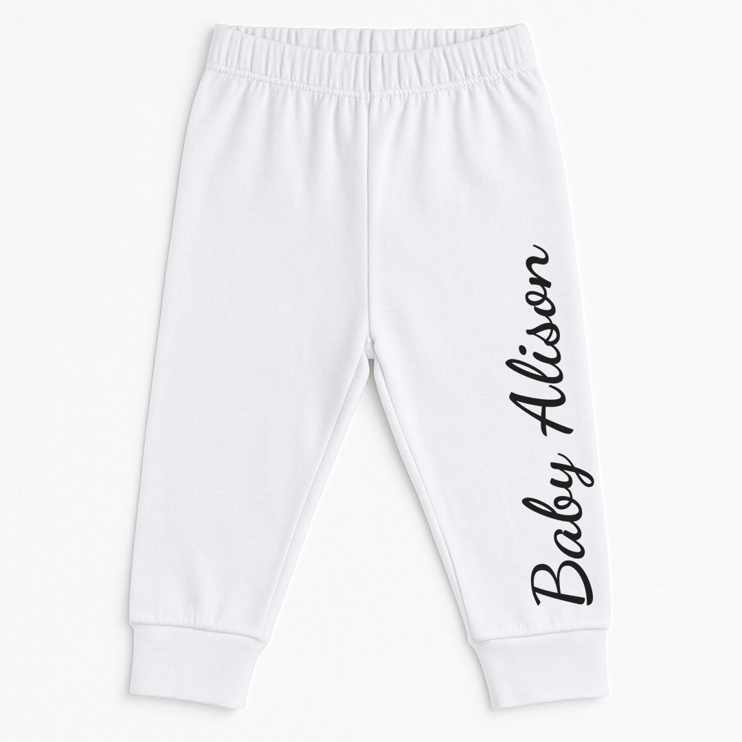 White baby jogger pants featuring elastic waistband and ankle cuffs for a snug fit. Personalized with the name "Baby Alison" in elegant black script, these pants are a perfect custom baby clothing item for both boys and girls.