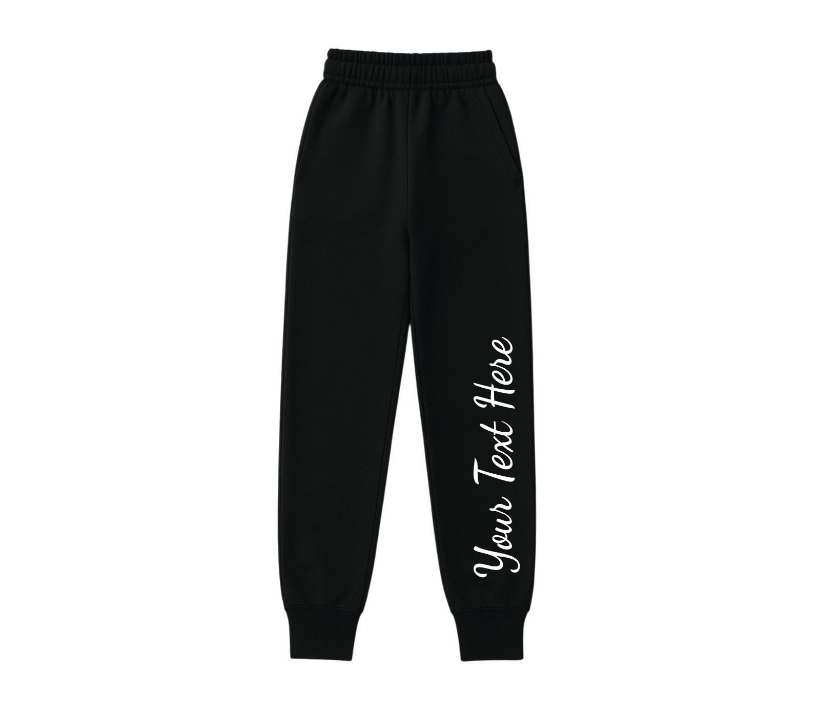 Black tracksuit for toddlers and kids, designed for everyday wear, featuring cozy fleece lining and durable stitching.