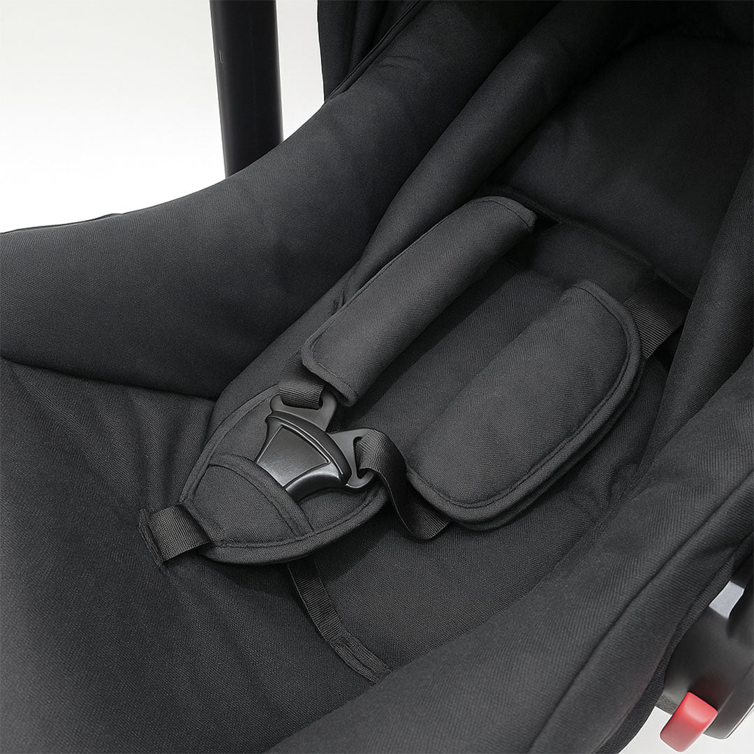 Ergonomic newborn car seat with side-impact protection and base compatibility for maximum travel safety.
