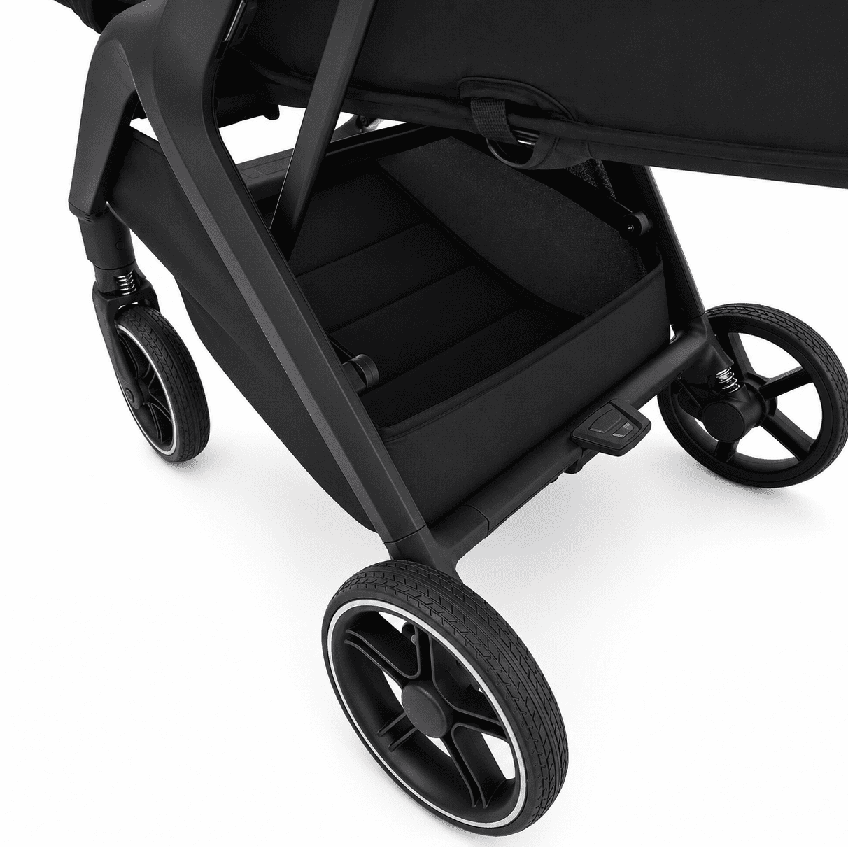 Close-up of a black stroller with a storage basket and large black wheels, photographed on a clean white background.