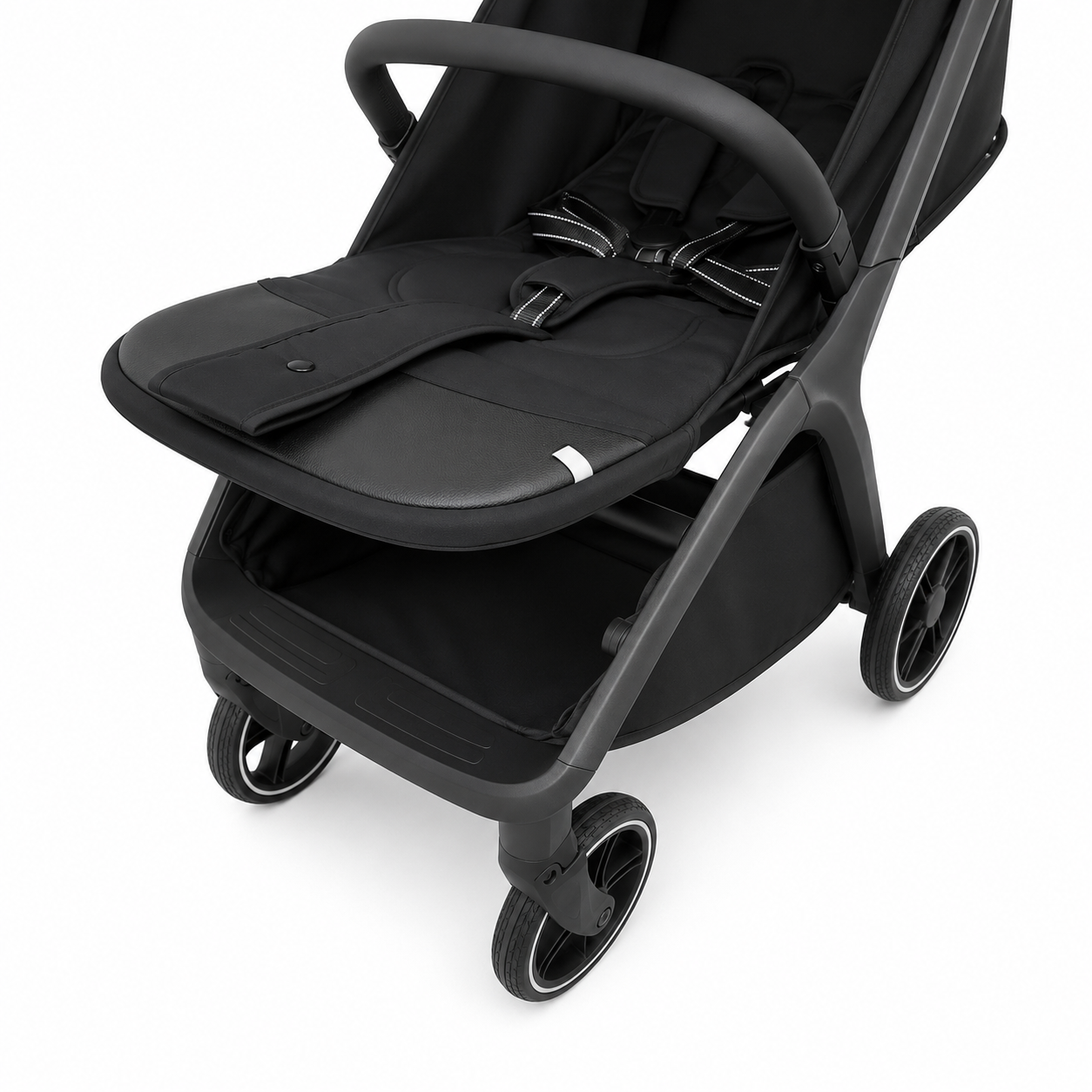 A close-up studio shot of a black stroller seat liner and matching footmuff on a dark gray stroller frame, shown against a plain white background.