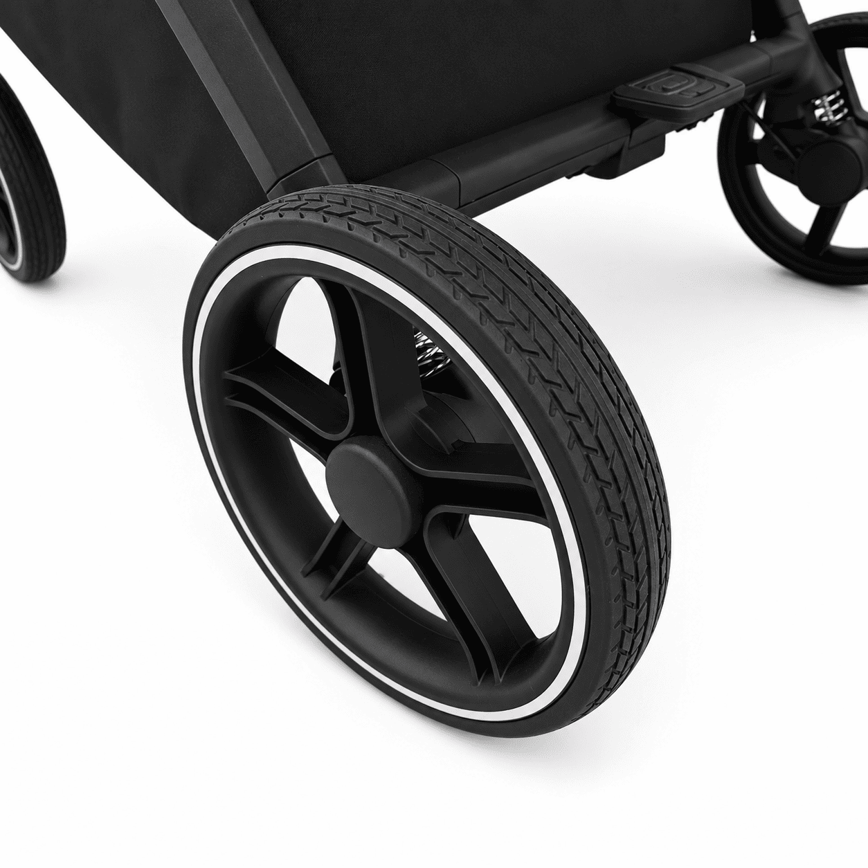 Close-up of a black stroller wheel with a matte black five-spoke hub and a thin white outer rim, shown on a clean white background.