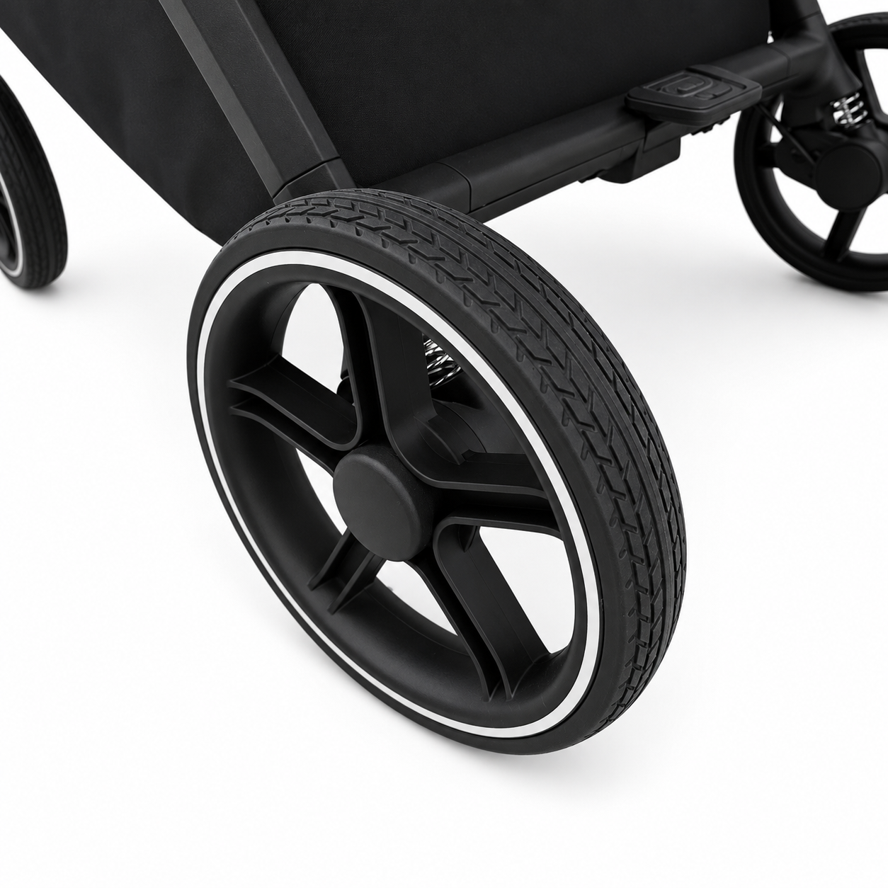 Close-up of a black stroller wheel with a black multi-spoke hub and a thin white outer rim, shown on a clean white background.