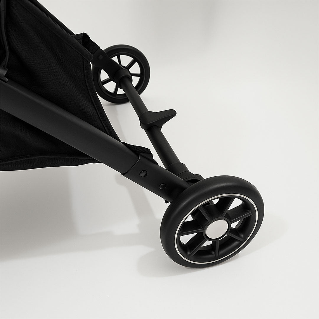 Alt Text: Foldable lightweight stroller with urban design, perfect for quick outings and compact storage.