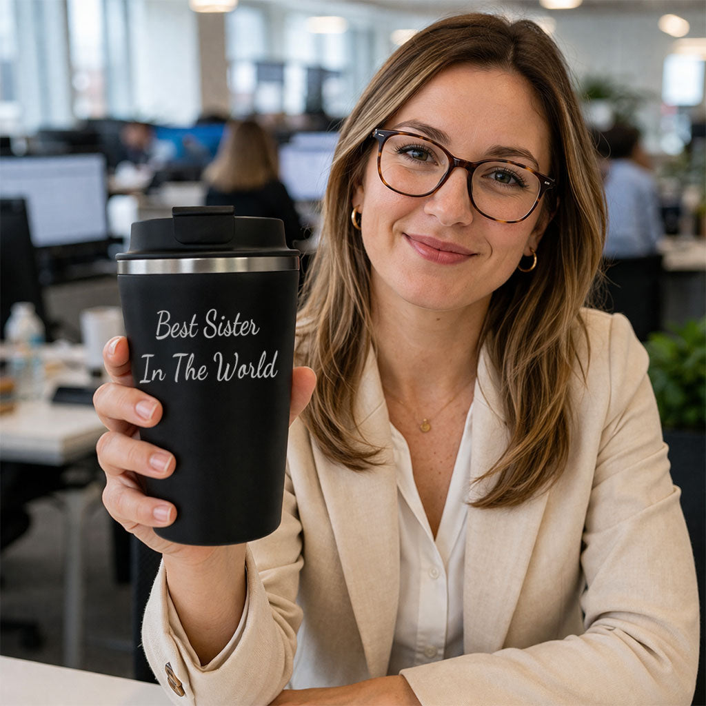 Woman holding personalised travel mug in office setting custom name coffee cup gift idea