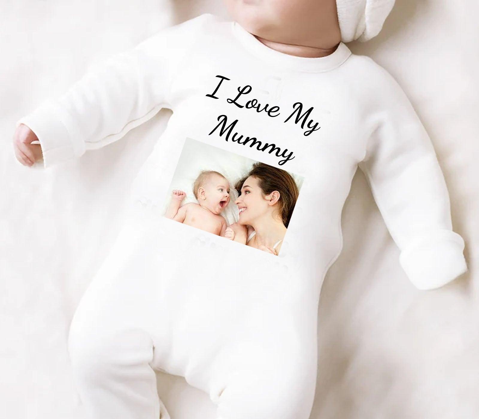 Personalised white baby romper with custom text and image application. Made from soft cotton, perfect for newborns, baby showers, and unique gift ideas.